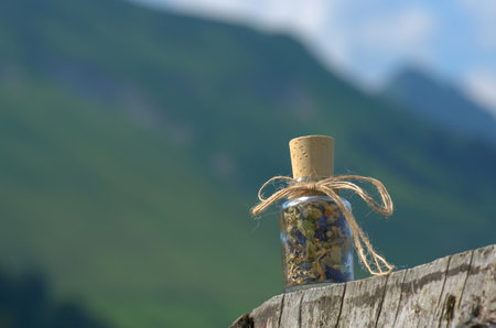 glass bottle with  dried mountain herbsの写真素材
