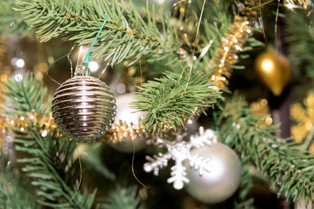 Christmas decorations hang on the Christmas tree. Christmas tree decorated with toys.の写真素材