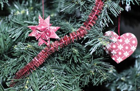 Christmas tree decorated with toys. Christmas tree decorated with paper toys.の写真素材