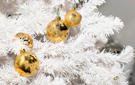 Christmas tree decorated with toys. White Christmas tree decorated with balls.の写真素材