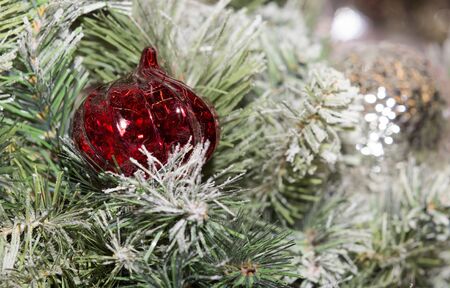 Christmas tree decorated with toys. Ball hanging on a branch of a tree.の写真素材