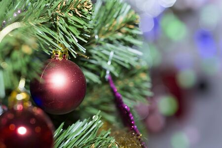 Christmas tree decorated with toys. Ball hanging on a branch of a tree.の写真素材