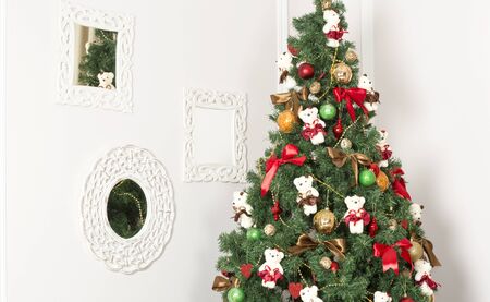 Christmas tree decorated with toys. Decorated Christmas tree with garlands and balls.の写真素材