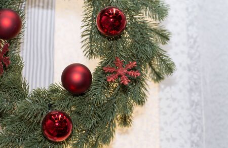 Wreath decorated with toys. Christmas wreath with baubles and the snowflake.の写真素材