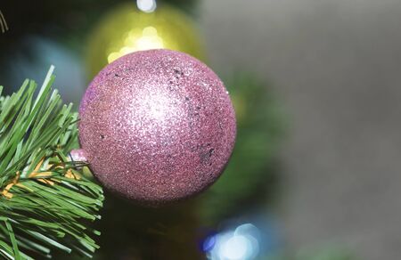 Christmas tree decorated with toys. Ball hanging on a branch of a tree.の写真素材