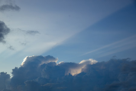 Clouds in the blue sky at sunset as an abstract background.