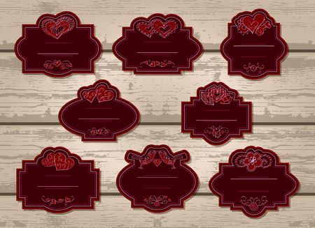 Vector set of labels with Valentine's Day elements: hearts, flowers and love birds. In red color.のイラスト素材