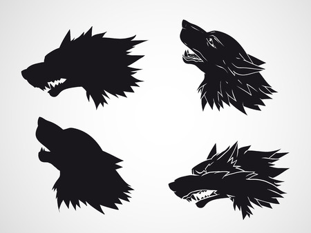 Vector set of hand drawn wolf heads. Black silhouette and stencil.のイラスト素材