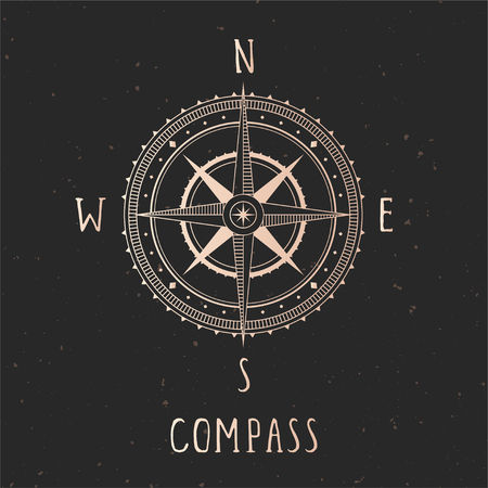 Vector illustration with gold compass or wind rose and frame on dark background. With basic directions North, East, South and West.のイラスト素材