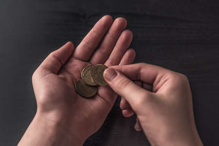 Business financial success concept. coins in the palm of your hand