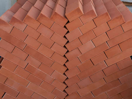 New factory red brick on pallets for sale in packaging in stock. Natural building material for...