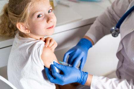 vaccination of children, a little girl at a doctors appointment, an injection in the arm, the conce