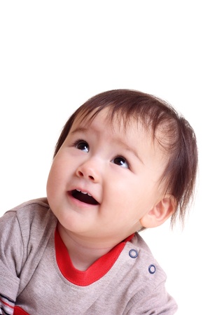 Pretty little girl looking up and smilingの写真素材