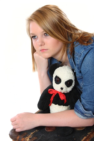 Pretty teenage girl apprehensive about leaving homeの写真素材