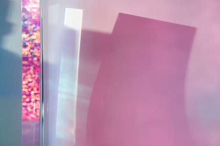 Abstract geometric background with prism, bokeh, pink and blue shadows