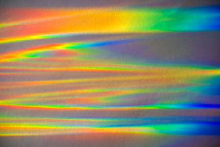 Prism Rainbow Water Reflections on Grey paper Background Overlayの写真素材