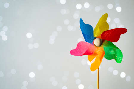 Colorful pinwheel on shiny white background with bokeh. Summer funの写真素材