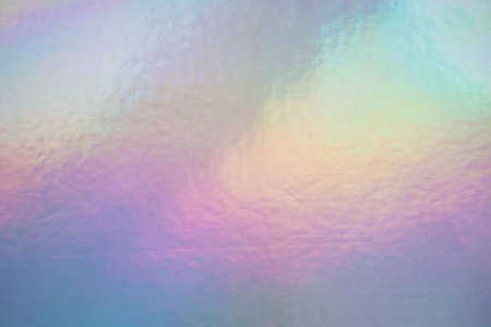Iridescent holographic foil background. Soft pastel colors backdrop. Trendy creative gradient.
