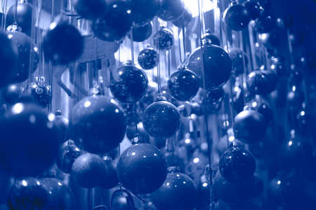 A lot of christmas ball decorations in Color of the year 2022 very peri dynamic vibrant periwinkle blue violetの写真素材