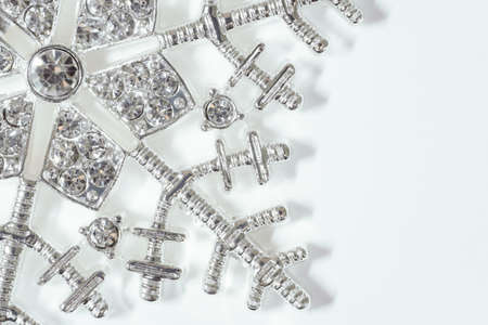 Fancy Silver and rhinestone snowflake on white background. Elegant deluxe Christmas symbolの写真素材
