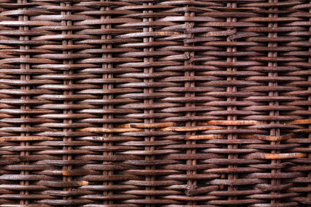 dark wicker wooden background. Weaving and hard work from natural resources components and environmentally friendly raw materialsの写真素材