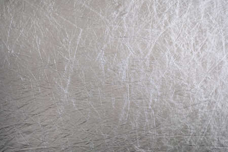 a wrinkled silver shiny textured reflector background