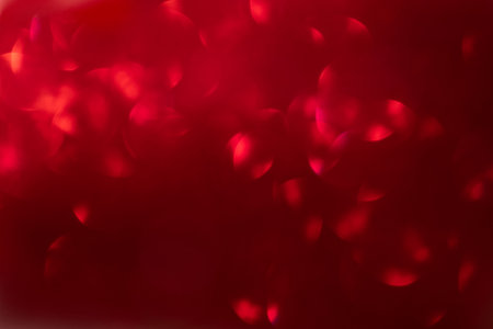 beautiful bright ruby red bokeh background. Overlay christmas valentines holiday textures for special effects or banner backgroundの写真素材