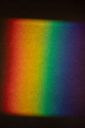 A Prism Full Rainbow Light on paper Background Overlay