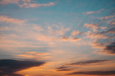 Orange and teal dramatic sunset sky with clouds. Photo backgroundの写真素材