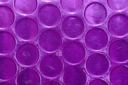 shiny metallic purple circle scratched texture. y2k futuristic geometric abstract backgroundの写真素材