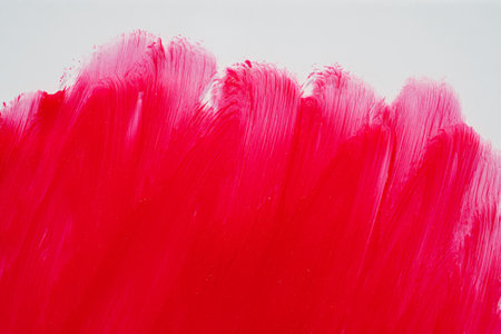 Bright red lipstick smear smudge background. Product sample texture for cosmetic marketingの写真素材