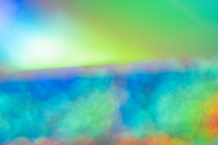 Blurred Iridescent holographic foil background with bokeh. Soft pastel colors backdrop. Trendy...