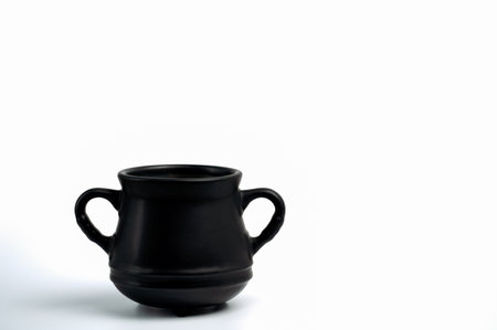Black matte cauldron pot on white background. Design element detail for magic fantasy photo composites or St Patrick'sの写真素材