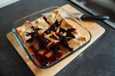 Cut blueberry pie in a glass dish. Autumn bakingの写真素材