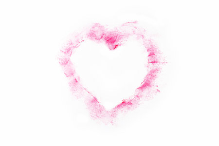 Isolated red lipstick smudge smear heart shaped. Cream makeup texture, cosmetics for Valentinesの写真素材