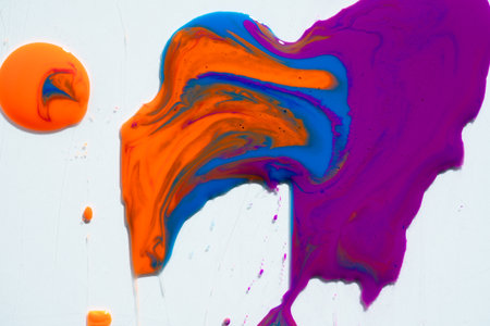 Abstract vibrant multi-color wet paint drops, swirl and splotch on white background. Purple orange and pink neon colorsの写真素材
