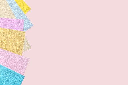 Pastel glitter paper on pink background. Versatile Easter-themed composition perfect for...
