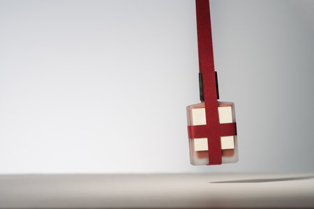 Blank beauty product with red paper ribbons. Minimalist mockup holiday product photoの写真素材