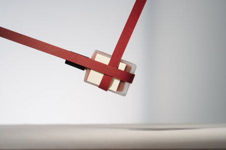 Blank beauty product with red paper ribbons. Minimalist mockup holiday product photo