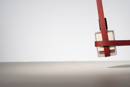 Blank product with red paper ribbons. Minimalist mockup holiday product photoの写真素材