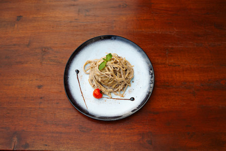 linguini pasta with cream. Delicious freshly prepared meal, perfect for menus, restaurants, or food delivery concepts.の写真素材