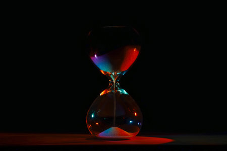 artistic glowing neon hourglass, symbolizing time and creativity. Vibrant lighting against a dark...