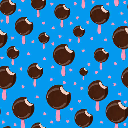 Seamless pattern with chocolate popsicle in cartoon style on a blue backgroundの写真素材