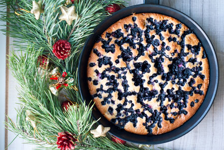Christmas cake with blueberries on a celebratory tableの写真素材