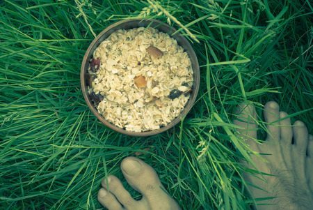 Morning breakfast outdoors - oatmeal with dried fruitの写真素材
