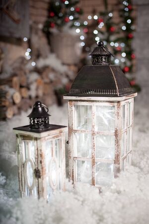 Lantern in the snow. Decoration in the room for Christmas.