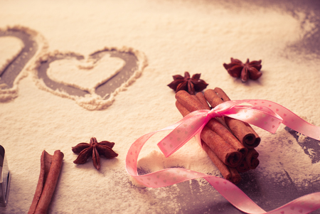 Background for Valentine's Day baking with hearts and flour.の写真素材