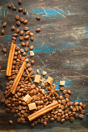 Background with coffe and spices at dark surface. Image toned, space for text.の写真素材