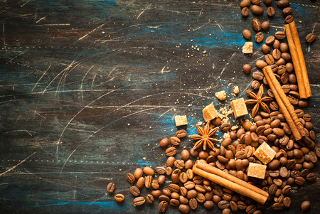 Background with coffe and spices at dark surface. Image toned, space for text.の写真素材