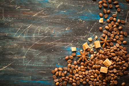 Background with coffe and spices at dark surface. Image toned, space for text.の写真素材